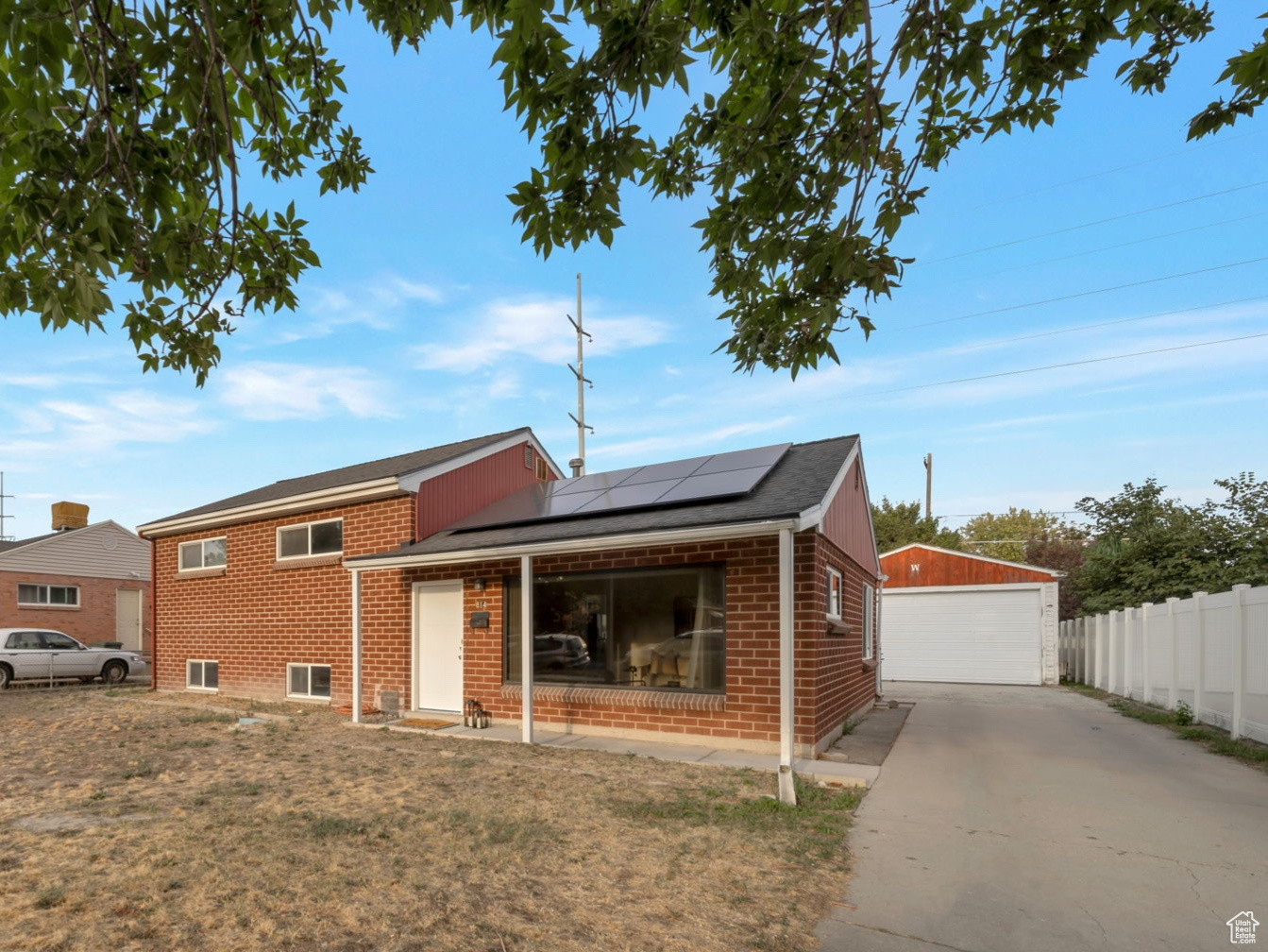Charming 1955 brick ranch in Rose Park featuring 4 bedrooms, 2 baths, and 1,820 sq ft. Enjoy a spacious two-car garage, covered patio, and mature trees on a generous lot. Quiet tree-lined streets and nearby amenities make this home truly inviting.