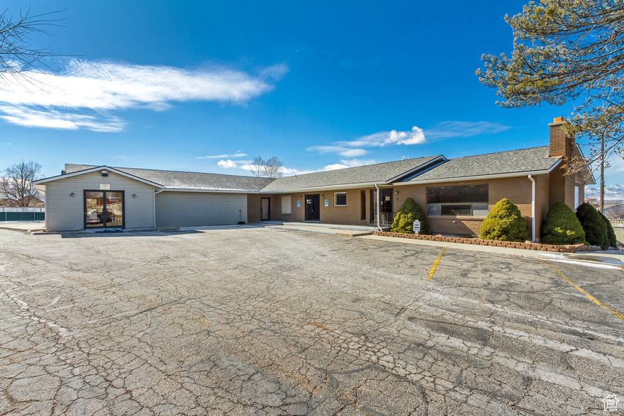 Unique Property with Two Buildings and Ample Parking. This exceptional property offers two distinct buildings on a spacious lot with an additional storage building. The first building is a 2,912 sq. ft. home, currently rented. The second building, is 5,312 sq. ft., and currently utilized as a church and features a large worship room, five classrooms, and three bathrooms-ideal for continued religious use. Approximately 50 dedicated parking stalls and additional land area for overflow parking, this property ensures ample space for gatherings and events.