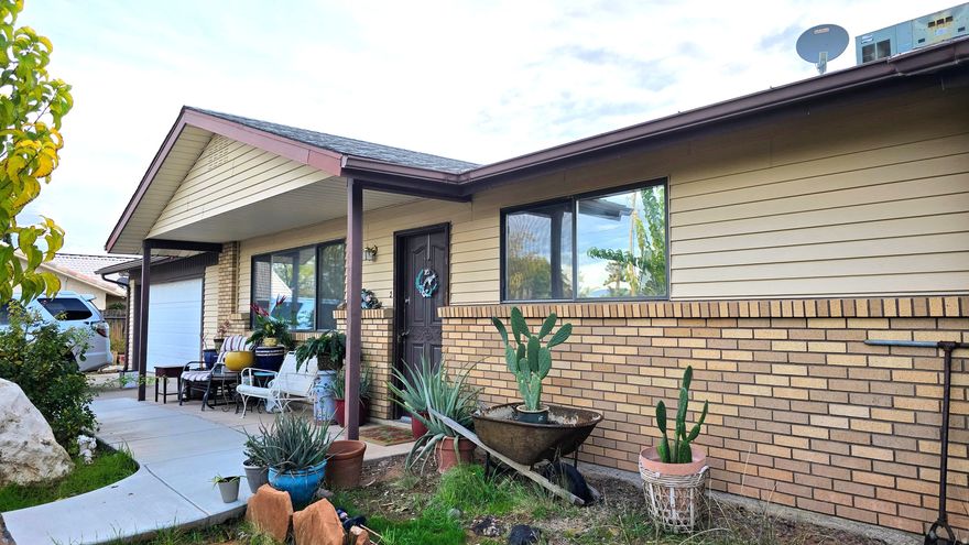 3-bedroom home on large lot and has a view of the Pine Valley Mountain. Gated access to backyard from both sides of the home also features a 543 square foot 2 Car attached garage with roll up golf cart door on back of garage. In addition, to the attached garage, there is an 840 square foot detached ATV / Boat or 2 car garage which can also be used as a workshop.  A stuccoed10' x 12' stick-built storage shed in backyard along with garden spot & dog run. Come see and make an offer!