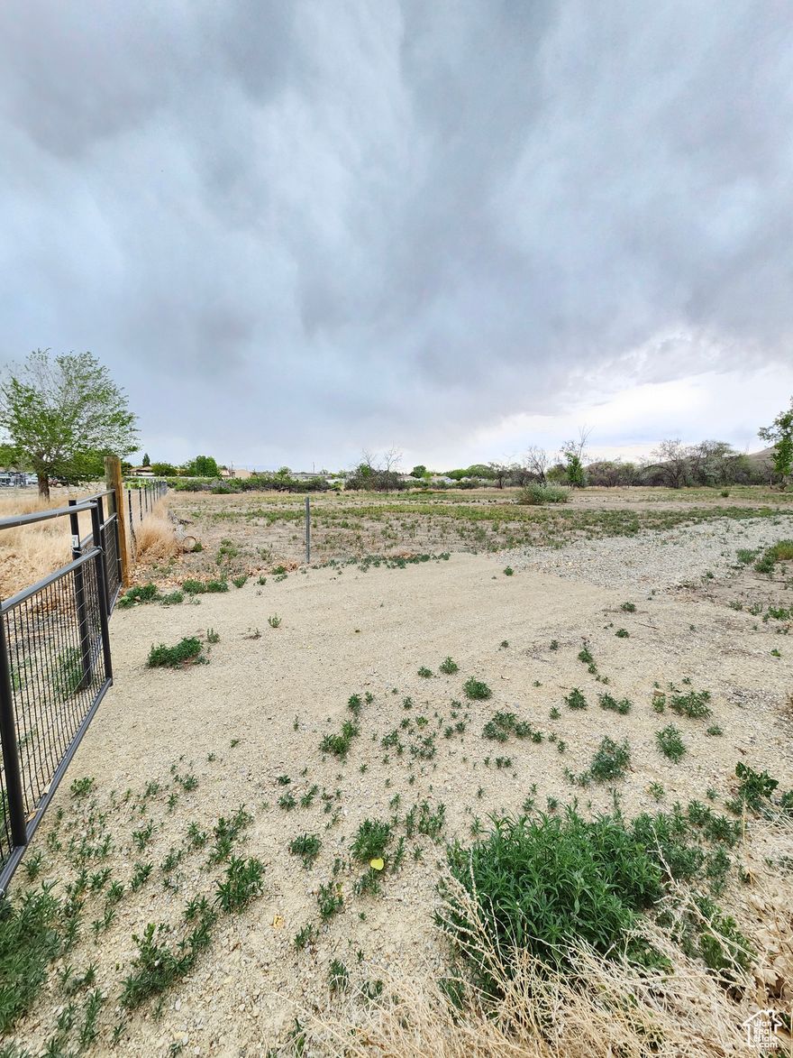 Great piece of land. Has been cleaned up and is ready for many possibilities. Currently has a gazebo, shed and fruit trees. Can build one big home with lots of extra land or zoning will allow up to 8 homes. A Maverick gas station was recently built just a few blocks away and is close to the freeway entrance. Please contact Zoning and Planning for Price City at (435) 636-3260 for more information on zoning.  Acreage figures are provided as a courtesy estimate only and were obtained from county records. Land was re-fenced, however a survey was not done to determine the exact boundaries.