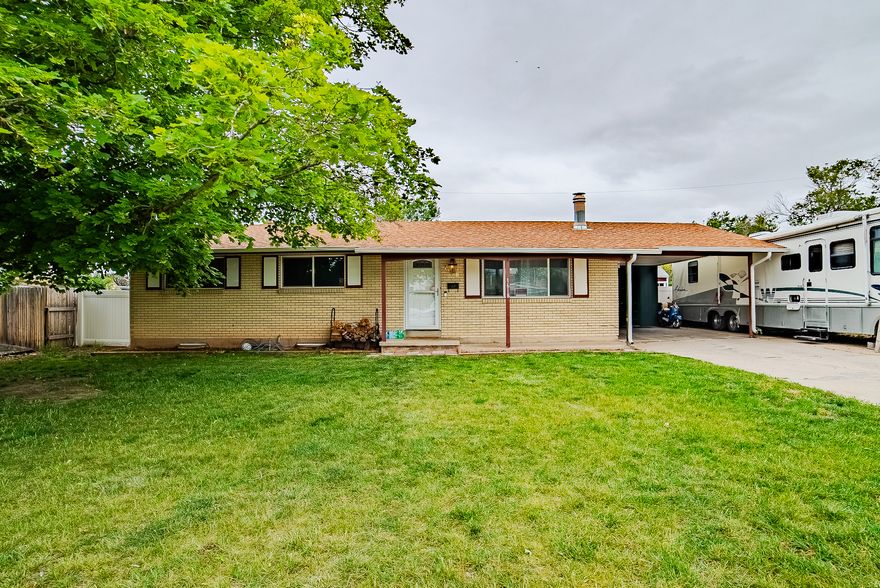 Wow, amazing home in great area, Lamanite floors, Several rooms with new paint, newer carpet, Wood burning fireplace, huge RV parking pad, huge family room in the basement.  Water heater and furnace less than 2 years old.   Square footage figures are provided as a courtesy estimate only and were obtained from County Records .  Buyer is advised to obtain an independent measurement.