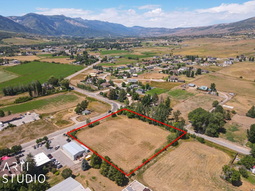 Highly desired property in the heart of Old Town Eden. 1.86 acre corner lot with high exposure frontage and potential commercial development. Convenient Highway access. Mature trees line the north side. Two Eden irrigation water shares are included on the Wilbur ditch. Close to Pineview Reservoir, Snowbasin, Powder Mountain and Nordic Valley Ski Resorts. Your opportunity awaits!