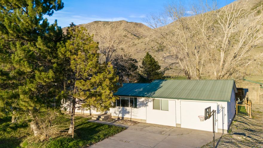 Turnkey Horse Property on 5.5 Flat Acres  Fully Updated & Ready to Go  Beautifully updated and thoughtfully designed, this exceptional 5.5-acre property offers the perfect blend of modern living and fully equipped livestock and equestrian functionality. Whether you're looking for space, privacy, or a fully usable setup-this property delivers.  The home has undergone major interior renovations, featuring 4 bedrooms and 2.5 bathrooms with upgraded systems throughout. Enjoy peace of mind with updated electrical and plumbing, along with brand new appliances including a washer, dishwasher, and oven. The home also features a brand new air conditioning system still under warranty, a new secondary heating and cooling system, and a newer water heater that is also under warranty-providing efficiency, comfort, and long-term reliability.  Step outside and you'll find a fully developed setup designed with both efficiency and usability in mind:   3-stall barn with tack room   5 large pens with shelters (ideal for multiple horses or livestock)   130 x 200 Riding arena equipped with brand new 40,000-lumen arena lighting   Electrical run to all pens, barn, and arena   2 Beautiful pasture spaces for grazing   4 water shares included  The 5.5 acres are completely flat, maximizing usability for riding, expansion, or additional structures. Paid off Solar panels add energy efficiency and long-term savings.  Take in stunning mountain views and unforgettable sunsets, all while enjoying a quiet country setting. Conveniently located.  This is a rare opportunity to own a move-in ready property that offers space, functionality, and flexibility. Made for horse people, by horse people.