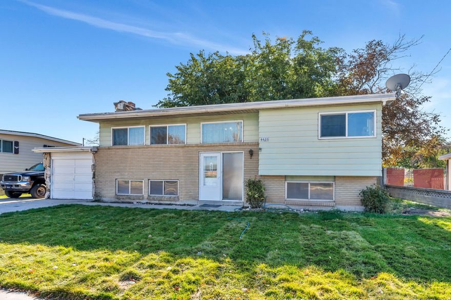 Charming home only 15 minutes from down town Salt Lake City, SLC airport and the mall!. This home features RV parking ,a fresh trailer pad and an abundance of natural light. THREE real wood burning fireplaces! If you have motorcycles, 4- wheelers or simply just need extra storage space this home is perfect! Primary bedroom features a walk in bathroom with a jetted tub!  Walk out of your kitchen onto a large covered deck perfect for indoor or outdoor dining! 1 attached garage and a massive detached 40x25  3 car garage  with an added 8x10 shed out back. This home provides plenty of space for project cars, woodworking or any other hobbies! All information, figures, and documentation provided as a courtesy, buyer to verify all information.