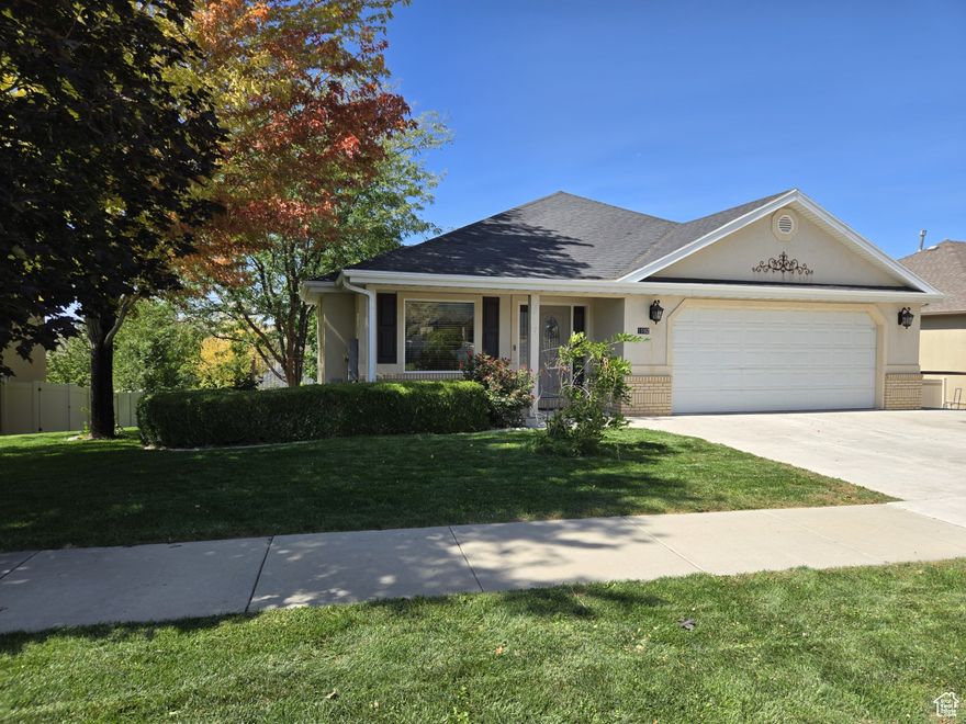 Price just REDUCED $20,000! Beautiful home inside & out in a great neighborhood. Main floor living with LVP flooring in living room and dining area. Nice kitchen with oak cabinets, new Corian countertops, tile backsplash & tile flooring. Amazing primary suite with manufactured hardwood flooring, with separate tub & shower, double sinks & large walk-in closet. Second bedroom upstairs was being used as office and walks out to a Trex deck overlooking the neighborhood, valley, and a beautiful Payson Landmark. Basement is fully finished with extra room under garage. Set up for a MOTHER -IN LAW APARTMENT  with a walkout entrance, and sidewalk to the front yard parking. Could easily become an ADU (ACCESSORY DWELLING UNIT).  (Check with Payson City) Huge garage has extra length & width. Also has lots of storage & a hot/cold water faucet. All appliances stay for both kitchens , including the upstairs washer & dryer. One of the basement bedroom has no window. Sellers will restore closet in upstairs office back to bedroom if desired. Measurements provided as courtesy estimate only. Buyers & agent to verify.