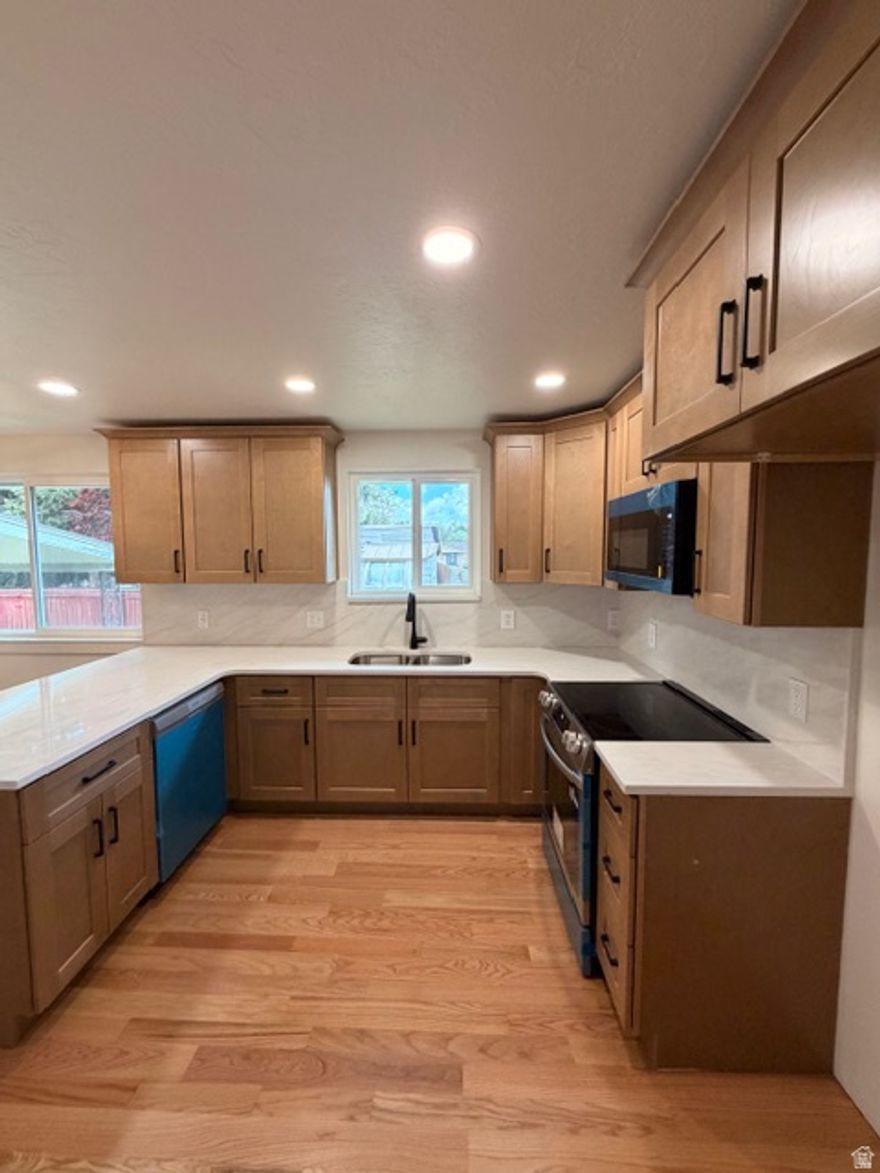 Y'all don't want to miss this stunning, remodeled West Valley stand out! This home has been thoughtfully updated, and it's anything but your typical white-on-white kitchen. You'll fall in love with the rich tile work and stylish finishes that bring warmth and character to both the kitchen and bathrooms.  Fresh flooring, updated lighting, and new doors give the home a modern feel, while all the big-ticket items have already been taken care of-newer roof, furnace, water heater, and even the water main line replaced in 2025.  The main level has a cozy fireplace and now offers 3 bedrooms with 2 bathrooms.  The back spacious back yard has a covered patio and endless storage with 3 sheds. This one truly stands out from the rest-come see it for yourself and feel right at home.