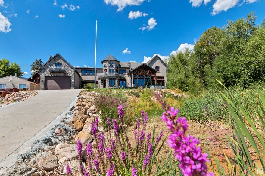 "The Castle on the Water" at beautiful Bear Lake!  Located just over the Idaho border.  Enjoy the beautiful craftmanship in this home, with ornate cabinets, Jerusalem marble floors, a Monastery front door imported from France, hardwood floors, grand rock fireplace with imported mantle, theater room, Chef's kitchen with custom cabinets, granite countertops, Sub Zero refrigerator, dbl wolf range, beverage cooler, 3 Dishwashers, ice maker, walk in pantry and custom designed raised bar!  Sold Furnished!! Perfect for entertaining large groups!  Enjoy a movie in the theater room, or relax on the beautiful deck overlooking the beautiful Azure waters of Bear Lake.  Primary bedroom suite has a large sitting area, gas fireplace, view of the lake and loft to the turret overlooking the lake!  Oversized 6 car garage with high ceilings and door.  Rentals allowed.   Square footage figures are provided as a courtesy estimate only and were obtained from Bear Lake County Assessor .  Buyer is advised to obtain an independent measurement.