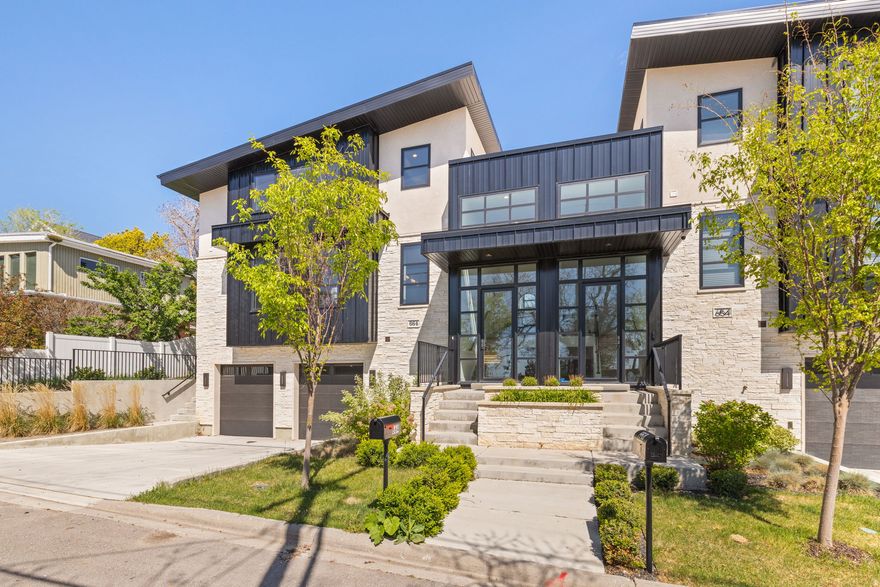 Perched above the heart of downtown Salt Lake City in coveted Capitol Hill, this striking modern home delivers luxury living with panoramic valley and mountain views at every turn. Designed to impress, this new construction residence showcases soaring ceilings, large, and an open-concept layout perfect for both entertaining and everyday living. The chef's kitchen is a true centerpiece, featuring premium Miele appliances, a 48-inch gas range with steam oven, built-in refrigerator, waterfall island, and sleek custom finishes. A dramatic floor to ceiling fireplace anchors the expansive living and dining spaces, while the private primary suite offers a spa-inspired bath with separate soaking tub and shower. A sculptural spiral staircase leads to the upper level, where an airy loft, two additional bedrooms, and a full bath create the ideal retreat for guests or family. The lower level offers exceptional flexibility with 9-foot ceilings, a spacious entertainment room or den, an additional bedroom and bath, laundry, and attached 2-car garage. Every detail has been thoughtfully curated, from high-end Anderson windows and doors to luxurious wool carpeting and designer finishes throughout. Outside, enjoy beautifully landscaped grounds, a private patio, and inviting garden spaces perfect for summer evenings. Just moments from City Creek Canyon, Memory Grove, and the vibrant dining, shopping, and nightlife scene downtown, this is elevated city living at its finest. Don't miss this opportunity, contact us today for your private showing. Square footage figures are provided as a courtesy estimate only. Buyer is advised to obtain an independent measurement.