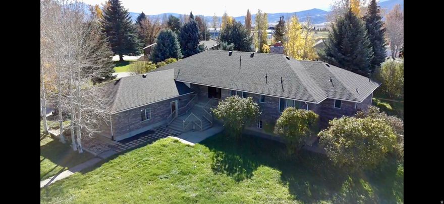 PRICE BELOW RECENT APPRAISAL, PRICE PER SQUARE FOOT AMONG THE LOWEST IN THE VALLEY! Beautiful custom home in the heart of Eden, Utah, just minutes from Pineview Reservoir and world-class skiing at Powder Mountain and Snowbasin. This residence offers year-round recreation in a peaceful mountain setting with a spacious open floor plan filled with natural light. The master suite features a spa-inspired bathroom and a private retreat, while additional bedrooms and living areas provide comfort for family and guests. Nestled on a full acre with mature trees and a nice garden, the property offers a tranquil, natural setting perfect for relaxation or entertaining. Ideal as a full-time residence, vacation home, or investment in one of Utah's most desirable mountain communities. PLEASE CHECK OUT THE VIRTUAL TOUR!