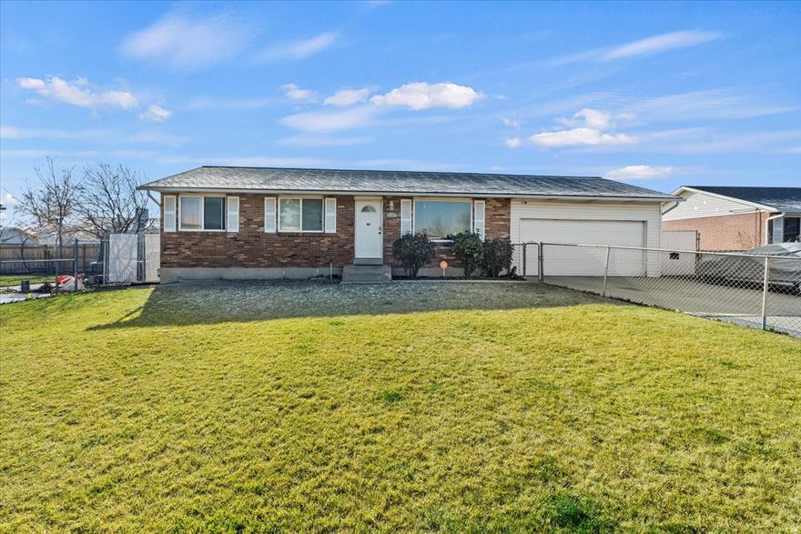 Located at the end of a quiet cul-de-sac, this 5-bedroom, 2-bath home offers a rare combination of space, parking, and yard at a price point that is increasingly hard to find in Salt Lake County. With over 2,000 square feet, a garage, a large driveway with ample off-street parking, and a fully fenced .19-acre lot, this property stands out for both size and flexibility-an excellent opportunity for buyers seeking long-term upside with some cosmetic finishing.  The main level features partially completed LVP flooring, giving the next owner the freedom to finish in their preferred style. The basement adds valuable living space with additional bedrooms that are fully floored, a second living area with unfinished flooring, and a second bathroom (approximately 50% completed). Ideal for buyers looking to add equity through light renovation and personalization.  Outside, enjoy a spacious yard with room to garden, entertain, or relax, complemented by established rose bushes in the front yard that bloom beautifully in the spring. The extended driveway and generous parking capacity make this home especially appealing for multiple vehicles, guests, or recreational toys.  Conveniently located just minutes from elementary, middle, and high schools, and less than five minutes to Harmons, Walmart, and everyday amenities.   Priced to reflect remaining updates, this is one of the most affordable 5-bedroom homes in Salt Lake County offering a garage, yard, and over 2,000 square feet. This home is an exceptional value with room to make it your own!