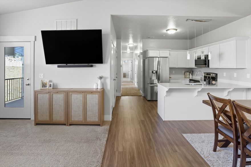 Welcome to your private retreat in the heart of Saratoga Springs! This top-floor 3 bed, 2 full bath condo stands out in the community with its vaulted ceilings, creating an airy, spacious feel you won't find on lower levels. Unlike many units in the complex, this home is ideally situated on the north side, offering a more secluded and peaceful atmosphere. Step out onto the private balcony, where you'll appreciate serene views, a nearby walking path, and not your neighbors' windows! With a thoughtfully designed living space, this home offers a perfect blend of comfort and style. Enjoy the semi-formal dining area, a dedicated laundry room, and generously sized bedrooms that provide space to relax and unwind. You'll love the added privacy of having only one neighbor below and no one above. A 1-car garage, plus a driveway/carport space, ensures convenient parking for you or your guests. Well-maintained and move-in ready, this condo is a rare find in a sea of similar floor plans. Whether you're a first-time buyer, downsizer, or investor, this unit offers the comfort, privacy, and livability you've been looking for.