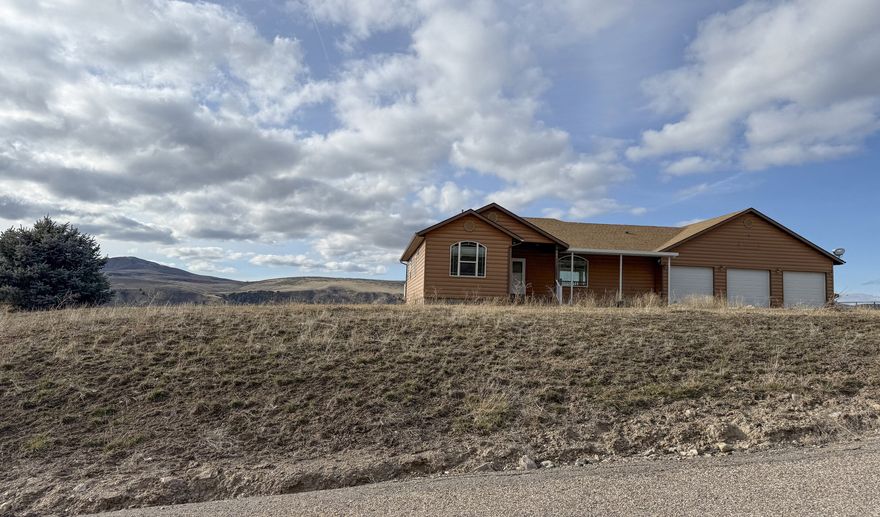 Experience exceptional privacy and panoramic mountain views on this stunning acreage property in Inkom. This custom-built home offers nearly 4,000 sq ft of living space with quality finishes throughout, including a spacious kitchen, open living areas, and large windows that capture the surrounding landscape. The home features 3 bedrooms, 3 bathrooms, a finished basement, and generous storage options. Set on over 16 acres, the property includes a 3 stall garage and a large 4 stall shop, providing ample room for vehicles, equipment, and recreational gear. Additional highlights include a wraparound deck, radiant heating, and a serene setting with year-round natural beauty. A rare underground rifle range and secure gun vault add unique value for the outdoor enthusiast. Located just minutes from I-15 access, this property combines seclusion with convenience-ideal for those seeking space, views, and a one-of-a-kind home in the heart of Southeast Idaho.