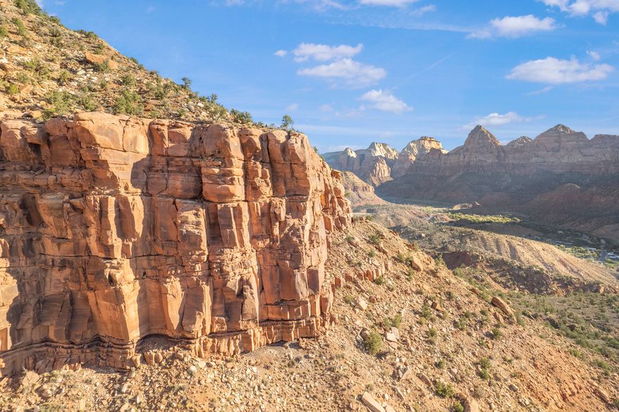 Nestled at the very top of the sought-after Kinesava subdivision, this .81-acre lot offers breathtaking 360-degree panoramic views of Zion National Park. Enjoy the peace and serenity of this quiet cul-de-sac location, just minutes from the entrance to the park. Experience nature at your doorstep with world-class hiking, biking, and outdoor adventures nearby, while being conveniently close to shopping, dining, art galleries, and more. This is a rare opportunity to build your dream home on a prime piece of land with unparalleled natural beauty and proximity to Zion National Park.
