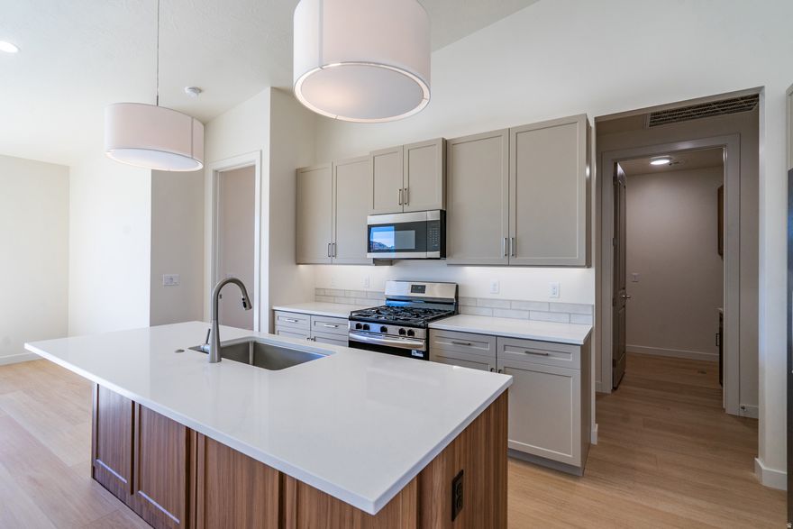 The Aurora Thoughtfully designed for comfort and style, the Aurora offers a spacious and efficient layout ideal for everyday living, a weekend retreat, or a lucrative rental. This 2-bedroom, 2-bath home features an open-concept living area that seamlessly connects the kitchen, dining, and great room-perfect for entertaining or relaxing. The primary suite includes a private bath and walk-in closet, while the second bedroom is positioned for privacy, ideal for guests or a home office. With abundant natural light, modern finishes, and optional outdoor living upgrades, Community Pool, BBQ area and Play ground coming NOW! Builder warranty, Lender incentive!