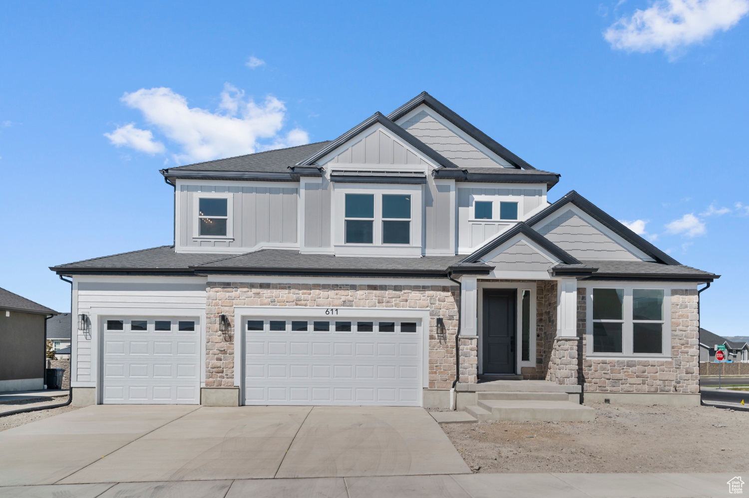 This beautiful brand new Montclair Traditional showcases timeless design with modern comforts in a great Lindon community! Features include a gourmet kitchen highlighting extended-height maple cabinetry with LED lighting, quartz countertops with a full-height backsplash, and stainless steel gas appliances including double ovens. An open layout flows seamlessly into the great room, highlighted by a gas log fireplace. Stylish laminate hardwood, tile, and carpet flooring add warmth throughout. This home offers 9-foot basement foundation walls, a spacious 3-car garage with exit door, and thoughtful upgrades such as USB outlets in the owner's bedroom, Christmas light package, and elegant 2-tone paint with textured walls. Bathrooms include custom tile surrounds, while black matte hardware provides a contemporary touch. Entrada base and casing finish the home with refined detail. This home is a must see!