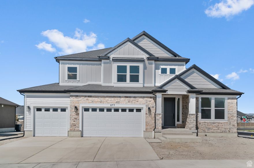 This beautiful brand new Montclair Traditional showcases timeless design with modern comforts in a great Lindon community! Features include a gourmet kitchen highlighting extended-height maple cabinetry with LED lighting, quartz countertops with a full-height backsplash, and stainless steel gas appliances including double ovens. An open layout flows seamlessly into the great room, highlighted by a gas log fireplace. Stylish laminate hardwood, tile, and carpet flooring add warmth throughout. This home offers 9-foot basement foundation walls, a spacious 3-car garage with exit door, and thoughtful upgrades such as USB outlets in the owner's bedroom, Christmas light package, and elegant 2-tone paint with textured walls. Bathrooms include custom tile surrounds, while black matte hardware provides a contemporary touch. Entrada base and casing finish the home with refined detail. This home is a must see!
