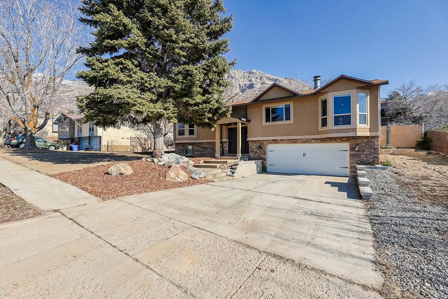 Welcome to this well-cared-for, west-facing home in North Ogden, offering a bright and comfortable layout with 2,101 sq ft of finished living space. The main level features an updated kitchen with granite countertops, along with a dining area and living space filled with natural light. The primary bedroom includes a separate bath, with additional bedrooms and a full bath providing space and flexibility. The basement adds a large family room and a fourth bedroom, creating additional room to spread out. Outside, the yard is a clean slate, ready for new landscaping and outdoor ideas. The home also features a large garage, newer HVAC, and no HOA. Conveniently located in North Ogden with nearby trail access.