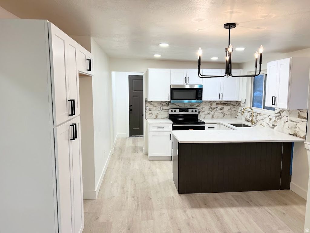 Photo of 3053 S 2855 W, West Valley City, UT 84119 (MLS # 2136651)