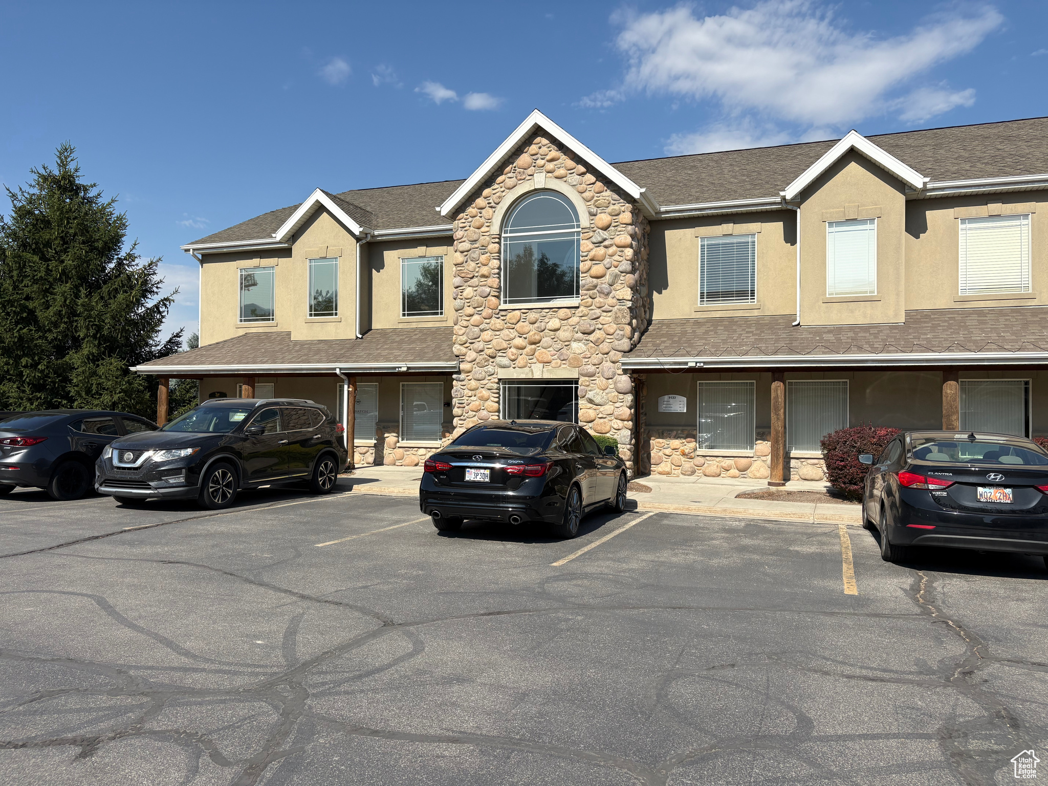 Gorgeous single unit office space with easy access off of I-15 near the America First Stadium. Business friendly community with 28 total business units within complex. This listing comes fully furnished, security system in place that you're welcome to sign up for. It contains a beautiful reception area, kitchenette with refrigerator & four private offices. $16 SF NNN lease