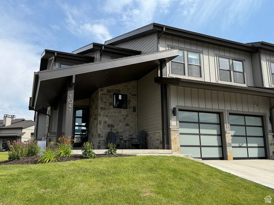 BUILT & Ready to occupy! Experience year-round mountain living in this stunning floor plan at Mayflower Lakeside-perfectly positioned between Deer Valley's East Village and Jordanelle Reservoir. Just 40 minutes from SLC International Airport and 15 minutes to Park City's world-class skiing, dining, and shopping.  This contemporary retreat features a main-level primary suite, soaring fireplace, gourmet kitchen with Viking appliances, and quartz countertops. Upstairs offers a second luxurious suite plus two bedrooms with a Jack-and-Jill bath-ideal for guests or family. Epoxy garage floors and professionally installed ski racks. Automatic shades on a wall of beautiful windows, and black out shades in the bunk room.  Nightly rentals are allowed-making this not only a beautiful getaway, but a smart investment. Community amenities include a soon-to-be-completed clubhouse with pool and hot tub, plus miles of planned trails.     Square footage figures are provided as a courtesy estimate only and were obtained from appraisals and plans .  Buyer is advised to obtain an independent measurement.
