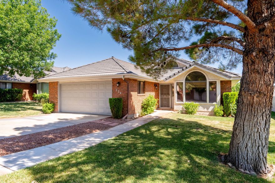 Stylishly Renovated Stand-Alone Home in the Heart of St. George. Welcome to this beautifully updated home in the sought-after Vintage subdivision - a rare stand-alone unit with a two-car garage and no shared walls! Step inside to discover a spacious, open layout with vaulted ceilings that create a bright and airy feel. The completely remodeled kitchen is a true showstopper, featuring brand-new cabinets, a stunning farmhouse sink, quartz countertops, stainless steel appliances, and a vented range hood for modern functionality and style. Additional upgrades include all new flooring throughout and updated bathroom vanities, giving the home a fresh, contemporary look. With its prime location, generous living space, and top-to-bottom renovations, this home is truly move-in ready -  All information deemed reliable but not guaranteed. Buyer and buyers agent to verify all information.