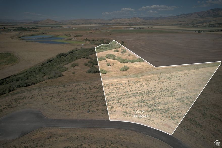 This 6.24 acre homesite combines privacy with natural beauty and 125 feet of direct Cub River access. The gently rolling land offers excellent building potential and space for recreation. Located just 15 minutes from Cherry Peak Ski Resort.