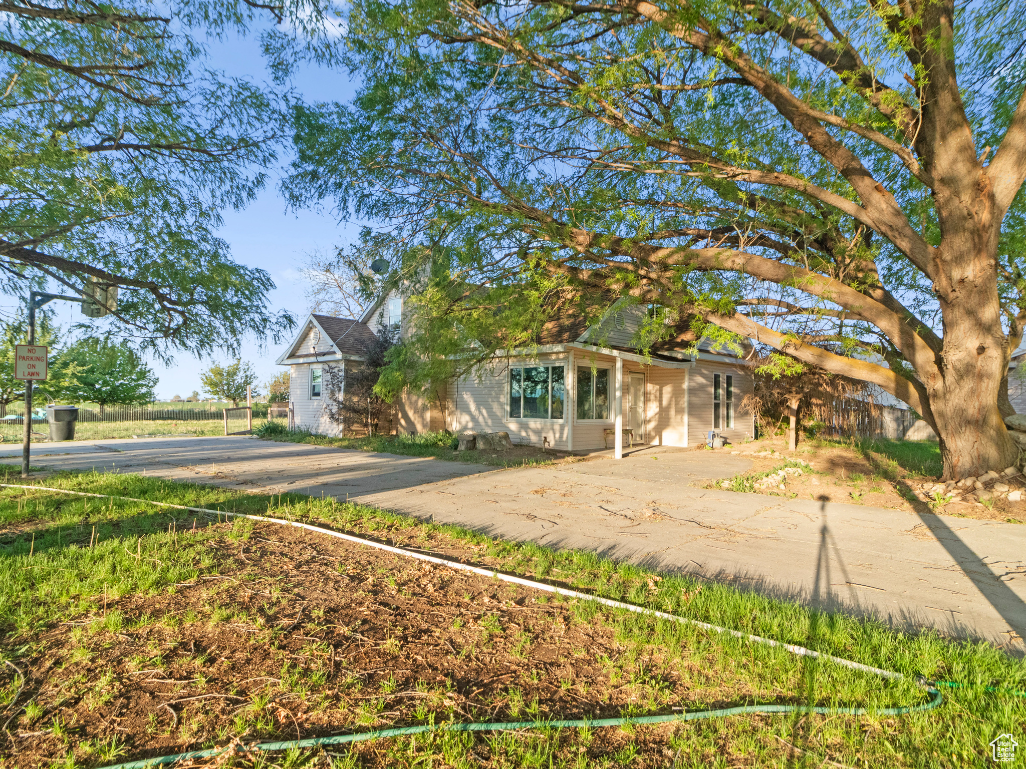 Welcome to this charming one-acre lot featuring an older home with great potential, perfect for those looking to customize and add extra bedrooms. Enjoy expansive county views from your private retreat, surrounded by mature trees including fruit trees. The property offers ample parking space, including dedicated RV parking with convenient hookups. Whether you're seeking a peaceful country lifestyle or a project to make your own, this lot provides the ideal canvas to create your dream home. Don't miss this rare opportunity! Animals are welcome. Includes parcels. 05-212-0010 and 05-212-0012. Sq. footage figures are provided as a courtesy estimate only per county records, buyer is advised to obtain independent measurement.