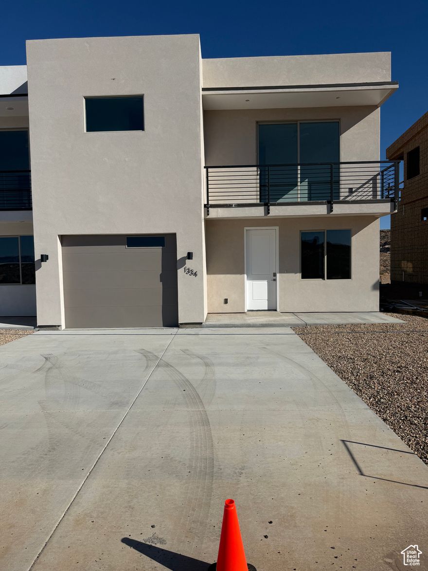 These townhomes welcome people with an open concept floor plan that highlights quality details with plenty of standard features. Bask under 9+ foot ceilings where you can enjoy meals at the breakfast bar or on the deck overlooking the lake and beautiful desert landscape. Lone Rock View Townhomes are perfect for your full time, investment, or vacation home for your getaway to Lake Powell, off roading and other outdoor adventures. When you purchase Lone Rock View Townhomes you get standard features included with the build such as solid surface countertops, luxury vinyl floors and much more.