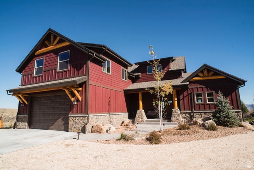 Rustic Lakeview Lodge  Spacious Retreat Overlooking Bear Lake Perched on a scenic hillside with breathtaking views of Bear Lake and the surrounding mountains, this spacious 9-bedroom, 5.5-bath retreat is the ultimate getaway for family gatherings, vacationers, or a turnkey short-term rental investment.  Designed with rustic charm, this home features warm wood accents, a stunning rock fireplace, and multiple TVs throughout for entertainment. The gourmet kitchen is built for hosting, complete with two ovens, a large fridge/freezer, and an 8-seat bar-perfect for group dining. A game room and kids' bunk room provide additional space for fun and relaxation.  Enjoy expansive outdoor living with a covered deck, patio, and a large yard featuring a kids' playset. Whether you're soaking in the views or heading out for adventure, this location offers it all-just minutes from UTV/ATV and snowmobiling trails, downtown Garden City's dining and shops, and Bear Lake State Park Marina.  With paved access, short-term rentals allowed, and being sold fully furnished, this home is ready for its next owner. Don't miss this rare opportunity to own a piece of paradise at Bear Lake!