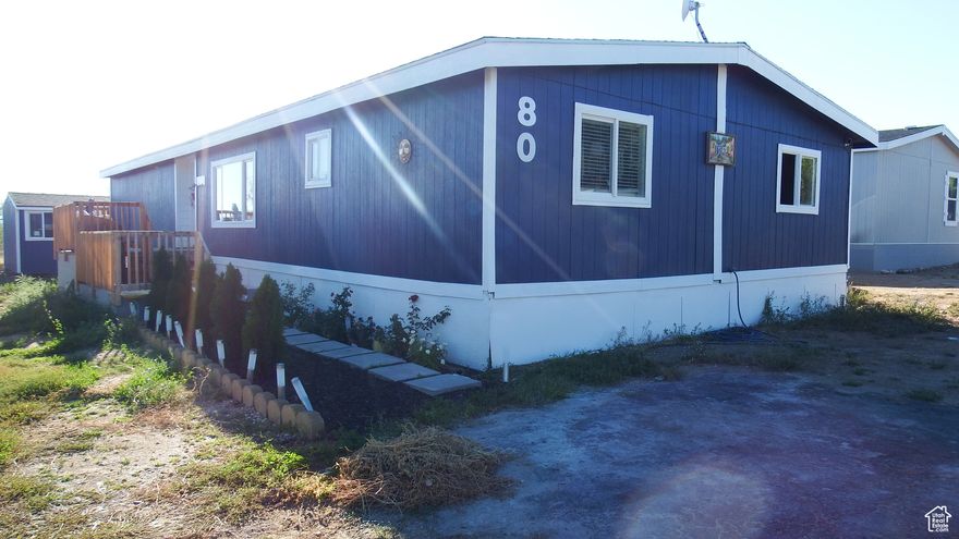 This renovated mobile home could be yours! It has been completely remodeled, both inside and out, with a new roof, siding, walls, ceilings, insulation, flooring, paint, electrical and more, all done in 2024. The AC unit and furnace are both new as well, along with the dishwasher, fridge, and range. This home features a beautiful new kitchen and living room and even a small office nook away from the common areas. The primary bathroom is currently being worked on and will be completed within a month. The primary bedroom has a large walk-in closet. Outside, both the shed and porch were built just this year. Buyer is encouraged to verify all information, the square footage is estimated and provided as a courtesy. Future residents will need to submit an application to East Meadows. Lot rent is $480 a month and covers sewer, water and garbage.