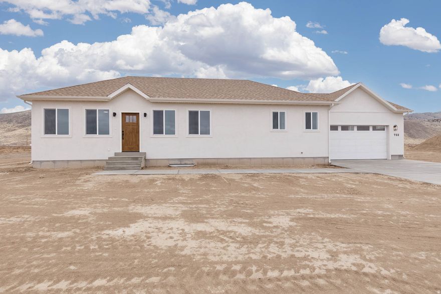 New construction home on 1.41 acres in the desirable Black Knoll Ranches subdivision. This 3-bedroom, 2-bath home offers 1,521 sq ft on the main level with an unfinished basement. The basement is already plumbed for two additional bathrooms and offers the potential to add up to three more bedrooms, allowing for future expansion if desired. Includes a 2-car garage and a functional layout designed for everyday living. Enjoy wide-open mountain and valley views from this scenic foothill setting, just 10 minutes from Richfield. The location offers a great balance of privacy, space, and convenience. Animal lovers and hobby farmers will appreciate the generous animal rights. Under town ordinance, the property allows up to 18 animal units, ideal for horses, cows, goats, chickens, rabbits, or a combination to fit your needs. Located in the newer Black Knoll Ranches Subdivision, this property offers rural living with modern access nearby. Estimated completion Feb 2026! All information provided as a courtesy. Buyer to verify all details.