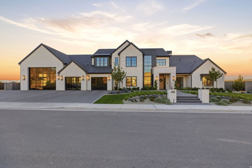 Welcome to this amazing Indian Knolls stunner-a JW West Homes 2025 St. George Parade of Homes masterpiece. Built without compromise and designed for those who demand extraordinary, this 8,768 sq. ft. custom estate on .61 acres in Indian Knolls sets a new standard for luxury living in Southern Utah.  From the moment you step inside, the steel-frame glass-enclosed den announces the intention behind every detail. Wide-plank hardwood floors, soaring ceilings, and Prestige Woodworks custom cabinetry carry throughout every level. The show kitchen is anchored by a leathered Matarazzo marble island, Sub-Zero refrigerator and freezer columns, a Wolf 48" dual-fuel professional range with brass bezels, and a full butler's pantry with its own dedicated appliance suite-engineered for effortless entertaining at any scale.  The primary suite is a private sanctuary featuring a spa-inspired bath in leathered White Pearl quartzite, a boutique walk-in closet, and an LG Styler steam system.  Below, the home transforms entirely. An indoor half-court basketball and full pickleball court-with a custom Jordan Jumpman logo, soaring ceilings, and a glass roll-up door opening directly to the pool deck-anchors a world-class athletic and wellness campus featuring a glass-enclosed gym with Rogue equipment, sauna, cold plunge, and light therapy. A rec room, custom bunk room, private salon, guest suite, and vault-door safe room complete the lower level.  Outside, Southern Utah's red rock canyon formations rise as a dramatic natural backdrop to a resort-caliber backyard by Palmer Pools, featuring a pool with waterslide, spa, fire features, covered pavilion with full outdoor kitchen, and a second outdoor pickleball court.  A fully integrated Control4 smart home system commands surround sound in every room and outdoors, lighting, climate, and pool automation-all from a single touch. Complete with an 8-car garage and RV bay, this estate is bold, exceptional, and unmatched.