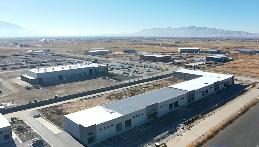 Prime Light Industrial Space in Spanish Fork! This large brand-new industrial unit offers the perfect blend of functionality and flexibility. With high ceilings, a large garage door, and I-1 zoning, it's ideal for a variety of business uses. This particular unit also comes with a large yard space!  The building includes a dedicated office space with a bathroom, while the rest remains open for versatile use to transform to fit your specific needs. Set for completion by the end of the year, this is a great opportunity to secure a high-quality space in a growing area. Buyer and buyer's agent to verify all information, including square footage, zoning, and permitted uses. Information is deemed reliable but not guaranteed.