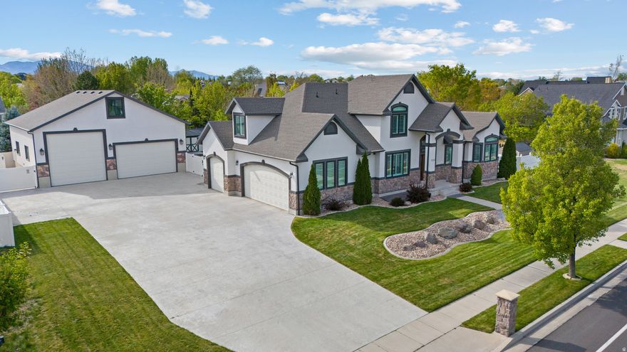 The Ultimate Luxury Estate & Hobbyist Retreat in Prestigious Parkway Palisades. , Meticulously updated half-acre estate with high-end interior finishes with unmatched utility. Premium Upgrades include: $100k in new Renewal by Andersen windows (45 total), fresh interior/garage paint, redone stucco (2022), and plantation shutters throughout. Designer Interiors: Fully finished basement and a primary retreat featuring skylights, new flooring, and a spa-like bath with a standalone soaker tub. All 4.5 bathrooms are fully remodeled. The Shop (40'x40'): A climate-controlled 1,600 sq. ft. dream space featuring a 10,000 lb car lift, 14' RV door, epoxy floors, 220V power, and a large storage loft. Outdoor Living: Professional landscaping with mature privacy trees, a new $18k concrete patio, and a color-matched 10x20 Tuff Shed. Location & Views: Unobstructed Wasatch Mountain views with direct access to the Jordan River Trail and nearby shopping/freeways. Perfect for the Contractor and Car Collector.