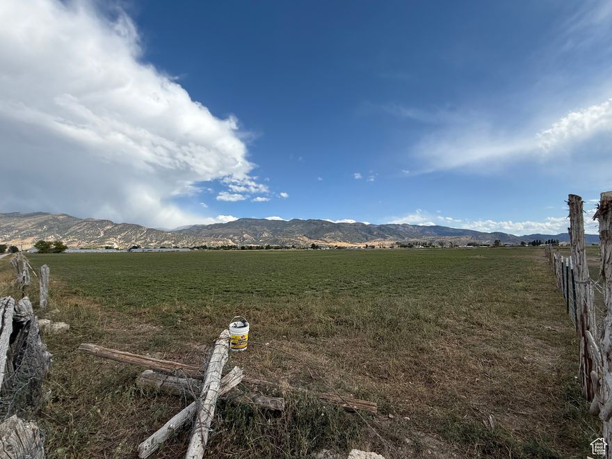 This is a wonderful running farm located in the northwest part of town, currently used for growing hay and raising cattle. The sale includes the following parcels: Parcel #6912 (15.88 acres), Parcel #6911 (8.26 acres), and Parcel #6895 (32.10 acres). The sale also comes with two water rights (Water Right #65-411 and Water Right #65-1157) as well as Manti City Creek B farm water shares (45 Shares)  and Manti creek and reservoir water shares (31 shares). All wheel lines on property are included. Please note that there is currently a lease in place that will be honored until May 1, 2026. The location offers stunning mountain views in every direction. It presents an excellent opportunity to develop this farm further with various options. Buyers and their agents are encouraged to verify all information independently.