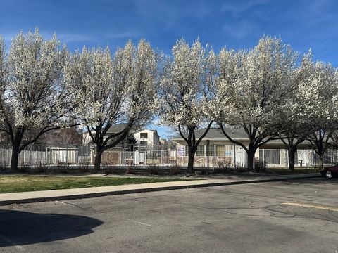 Photo of 3835 S RIVER RUN WAY W #1, South Salt Lake, UT 84119 (MLS # 2144052)