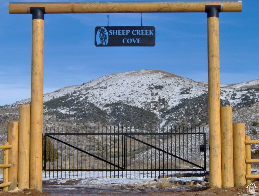 Tucked between Hardware Ranch and Monte Cristo, this .69-acre lot in the highly sought-after Sheep Creek Cove community offers the perfect blend of beauty, privacy, and adventure. Towering trees and breathtaking views surround the property, creating an ideal setting for your future cabin retreat or simply a peaceful place to relax and recharge. This lot is truly build ready, with water and a septic tank already in place, giving you a head start on making your dream cabin a reality. Sheep Creek Cove spans more than 1,000 acres of shared space to explore, complete with campsites, a river, and a large lake for fishing, paddleboarding, canoeing, or swimming. From your doorstep, you'll have direct access to endless forest service trails.   From majestic moose and curious deer to playful squirrels and busy beavers, you'll be surrounded by nature at its best. Whether you crave endless outdoor adventures in every season or simply a quiet place to unwind, this property provides the perfect backdrop to make it yours.