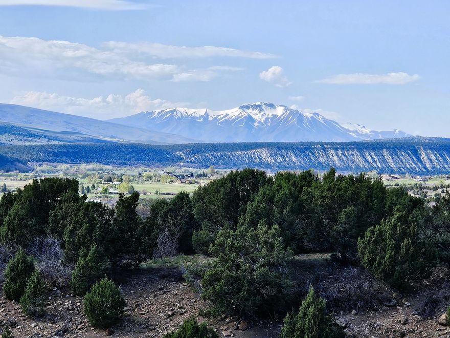 Mountain and valley view lot with a stream at the bottom of the hill and your own deer hard as neighbors. Has year round access and ready to use today! Water is connected, power is available on the lot. Less than a half mile from the gated entrance. Wildlife included for free. Bring your trailer or build a cabin or both on your own mountain property today and really take advantage of all that mountain life has to offer. Come enjoy the cool crisp mountain air as you get away from it all. Resort amenities include pavilions for gatherings, pickle ball, tennis, swimming pool, golf course and much more! Each lot owner receives a free $60 punch-pass per year plus member pricing. Nearby you will find lakes, camping, four-wheeling, hiking, fishing, hunting, rock climbing, snowmobiling, snow shoeing and other outdoor activities. The Manti-LaSal National Forest and Skyline Drive Trail System are only minutes away. Close by, in town, you have a grocery store, hardware store with a lumber yard, hospital, pharmacy, restaurants, even a drive-in theater. Sewer would be septic, gas would be propane. Google Map/Earth is 39.60687, -111.40481 Elevation is 6,413. Buyer to verify all information.