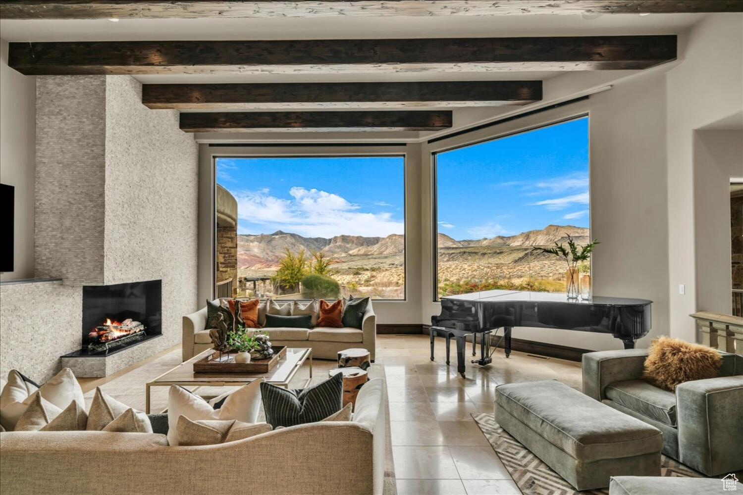 Step into the epitome of modern luxury nestled on an exclusive rim lot in The Ledges, overlooking Snow Canyon State Park. This exquisite residence offers wide open views of Snow Canyon and The Ledges Golf Course. Originally showcased as a parade home, it exudes superior craftsmanship and opulent finishes at every turn. With sophistication and comfort seamlessly blended, you will feel right at home. The meticulously designed floor plan features thoughtful interior spaces and generous outdoor living areas...all perfect for entertaining. Inside, indulge in your own private spa with a steam room, sauna, and exercise room, or kick back in the comfortable theater. This stunning residence boasts a rare and luxurious private elevator, providing convenient access to all levels of the home. Outside, unwind with a refreshing swim in your private multi-tiered pool with grotto and waterslide. Discover a gated front courtyard and a sprawling backyard oasis adorned with lush landscaping. Enjoy the covered patio complete with cooling misters and a built-in BBQ. Whether entertaining or enjoying serene moments, this outdoor haven provides the perfect setting. Additionally, a furniture package is available for negotiation, offering the opportunity to effortlessly transition into your dream home.