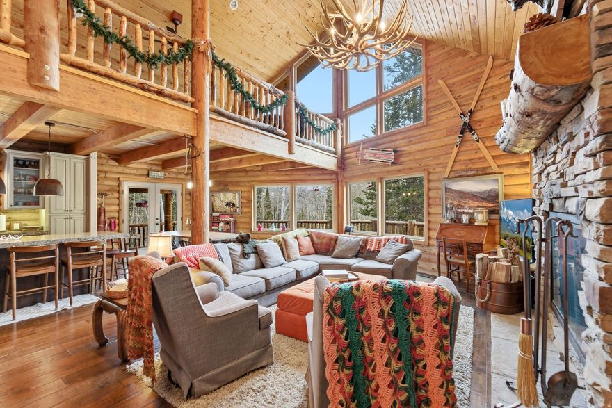 Nestled at the top of the coveted Pine Mountain cabin community just east of Oakley, UT, this impeccable 4-bedroom, 3-bathroom seasonally accessible retreat backs directly to HOA open space and national forest - offering privacy, serenity, and breathtaking natural surroundings. Newly constructed in 2013, this 3,139 sq ft cabin seamlessly blends rustic charm with modern comfort across three thoughtfully designed levels.  The main level welcomes you with a well-appointed kitchen, breakfast bar, and informal dining area, all flowing into a great room anchored by a stunning stone-hearth fireplace. A main-level bedroom and full bathroom add everyday convenience, and a massive deck just off the living area invites you to slow down and soak in the surrounding beauty. Upstairs, a dramatic open loft overlooks the main level alongside the spacious primary suite, and the upper bathroom is a true showpiece featuring a striking copper soaking tub. The lower level rounds out the home with a rustic wood-burning stove, an additional living area, bedroom, and bathroom, with a walkout to the outdoors.  Pine Mountain is a gated community revered for its paved roads, national forest access, community horse pasture, and tennis courts. World-class fly fishing on the Weber River and Smith & Morehouse Reservoir are just minutes away, making this the perfect mountain escape.