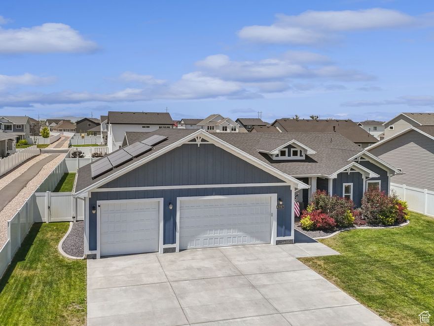 *OPEN HOUSE SATURDAY 12-2PM* NOW offering 1% buy down incentive. Built in 2020, this well-maintained home offers convenient main-level living with a 3-car garage and paid-off solar panels. Master bedroom has a large walk in closet, dual vanities and separate toilet room. This home is located near open farmland, yet just minutes from freeway access and grocery shopping. Enjoy the best of both worlds with peace and quiet plus quick access to amenities. 30 minutes to Pineview Reservoir and Snowbasin Resort. The backyard is the perfect size for easy maintenance and outdoor enjoyment. Garage gym can stay if desired. A great fit for those looking for efficient, modern living in a prime location. Square footage figures are provided as a courtesy estimate only and were obtained from county records. Buyer is advised to obtain an independent measurement.
