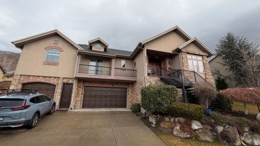 Located on a quiet cul-de-sac within an exclusive gated community of 22 homes, this Cottonwood Heights residence offers privacy adjacent to the historic Old Mill. The interior features soaring vaulted ceilings and an open-concept floor plan that seamlessly connects the living area to a gourmet kitchen finished with alder cabinetry, granite countertops, and travertine flooring. Convenience is prioritized with a spacious main-floor primary suite featuring a jetted tub and walk-in closet. Positioned just five minutes from the freeway and 20 minutes from downtown Salt Lake City, this location provides immediate access to Utah's world-class ski resorts.