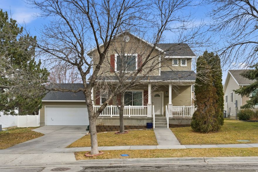 Must-see two-story home in Overlake! Enjoy stunning western sunsets from the large covered front porch. The main level offers a formal dining room, spacious family room with fireplace, and a new kitchen featuring granite countertops, plus a half bath and laundry room. The kitchen opens to an oversized composite deck overlooking a fully fenced backyard with views of the Oquirrh Mountains. Upstairs, you'll find a generous master suite with a walk-in closet and a well-appointed bathroom with separate tub and shower, along with two additional bedrooms and an additional bathroom. New tankless water heater and on-demand hot water in the master sink. This beautiful home also has updated light fixtures. The unfinished basement provides a blank canvas to finish exactly how you want. Ideally located near the new Tooele High School and the Tooele Temple.