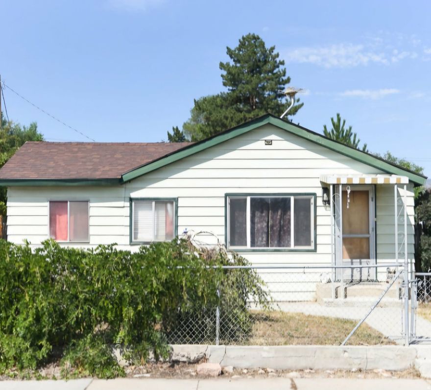 Single-family home on a 0.18-acre lot with a shop and mostly fencing. Property needs work and will not qualify for financing. Furnace and water heater replaced in 2017; roof approximately five years old.  Located near local schools.  Sold AS IS. No repairs, replacements, or concessions to be made by seller. Buyer to verify all information.  Listing agent has a partial ownership interest in the property.