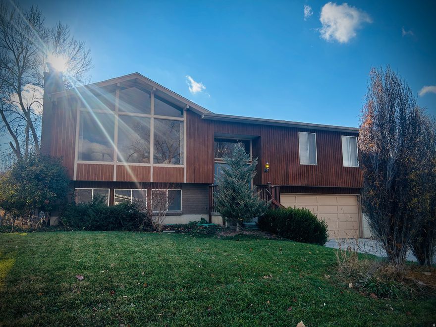 One of the coolest things about this property is that it comes with a separate adjoining lot (22-09-329-050), giving you a total of .43 acres - which is almost unheard of in this neighborhood. The owner was able to buy the extra lot years many years  ago, making this a rare gem that is nearly impossible to find in the neighborhood. The house itself has huge windows that let in a ton of natural light, and it's built really solid - the kind of place with great bones that you can update over time without stressing about major issues. The location honestly couldn't be more convenient, with shopping, malls, schools, and parks all close by. A big combined lot, a well-built home, and a super central spot - it's a rare find around here.