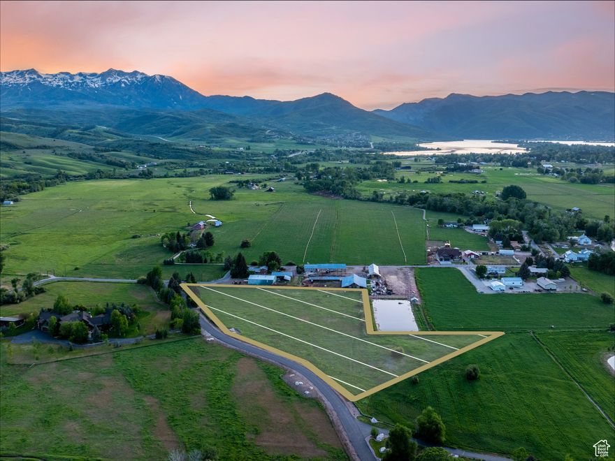 Situated above the serene landscapes of Ogden Valley, this remarkable 5.25-acre estate parcel offers truly panoramic views-from the rugged peaks of the Wasatch Range and the slopes of Snowbasin Ski Resort to the lush, winding beauty of Southfork Canyon. Located within the coveted River Ranch community, one of Huntsville's most prestigious and private luxury enclaves, this homesite combines the tranquility of nature with the sophistication of a legacy estate setting. Whether you envision an elegant mountain retreat, a spacious family compound, or a refined horse property, this land provides an extraordinary canvas for your vision. With gentle topography, ample space, and a setting that feels both expansive and intimate, the parcel offers unmatched potential. Step outside and enjoy immediate access to world-class recreation: ski at Snowbasin, Powder Mountain, or Nordic Valley; boat, paddle, or fish at Pineview and Causey Reservoirs; tee off at nearby Wolf Creek Golf Course; or explore endless trails on foot, horseback, or bike. Surrounded by pristine wilderness and yet just minutes from modern conveniences, this is a rare opportunity to claim your own piece of paradise in Northern Utah's most treasured valley. All property information, boundaries, and documentation to be verified by buyer.