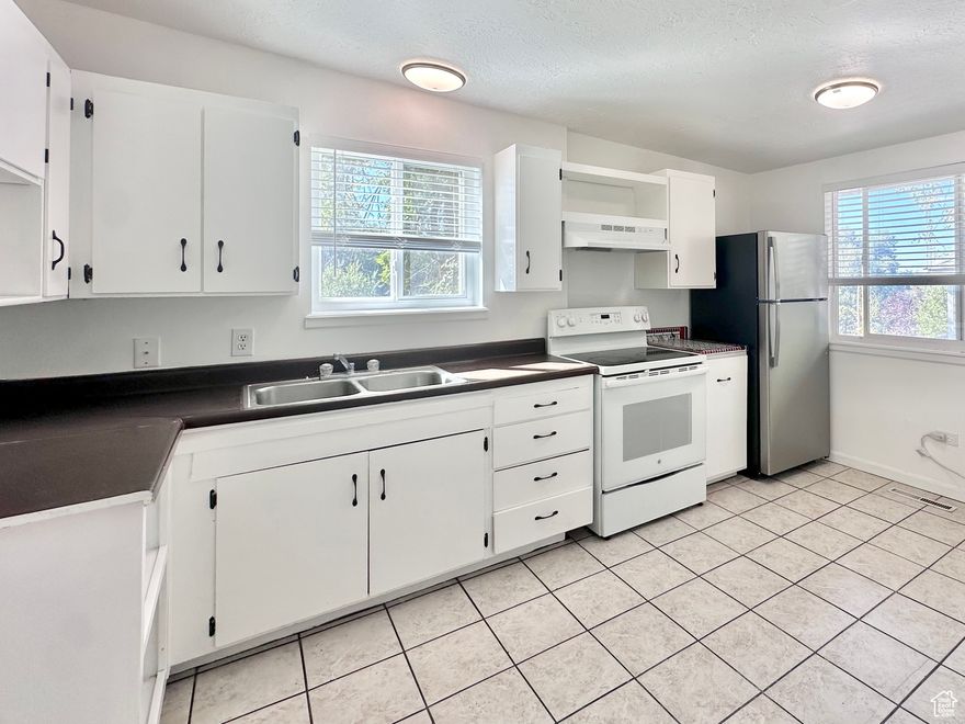 INVESTORS LOOK (1031) at 2 adjoining duplexes near Weber State University. Each unit has 2-beds / 1 bath with a dedicated garage.  Situated near campus, shopping district, and public transit, this property is perfectly positioned for consistent occupancy and long-term value.  Listing property facts and list price are specific to this parcel.  Buyers are encouraged to purchase both properties together.  Adjoining parcel See MLS# 2098915.  Photos are representative of condition as all units are occupied.  No seller financing.