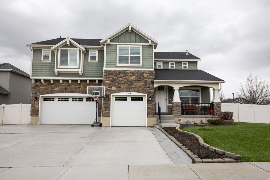 Stunning corner-lot home in desirable East Sandy with breathtaking Wasatch Mountain views. Built in 2015 and offering over 3,700 square feet, this beautifully designed 4-bedroom, 3.5-bath home combines spacious living, thoughtful upgrades, and an unbeatable location.  Step inside to raised ceilings and a double-height living room filled with natural light. Hardwood floors installed in 2020 run throughout the main living areas, complementing the open layout and high-end finishes. A spacious main-level office provides the perfect work-from-home space.  The vaulted primary suite offers a private retreat with a sitting area and a luxurious spa-style shower. The fully finished basement features a theater room and kitchenette - ideal for entertaining, hosting guests, or creating a comfortable multigenerational living space.  Outside, the .18-acre corner lot offers mature trees, mountain views, and plenty of space to enjoy the outdoors. The backyard includes a custom pet deck, electronic dog door, and a Sundance hot tub for year-round relaxation.  Additional highlights include a new furnace (2025), durable Hardie board exterior, a large 3-car garage with epoxy floors, RV pad, and permanent holiday lighting. Conveniently located near Fort Union shopping and dining and close to Union Middle School and Hillcrest High School.  This home offers the perfect blend of comfort, style, and location in one of Sandy's most desirable neighborhoods.