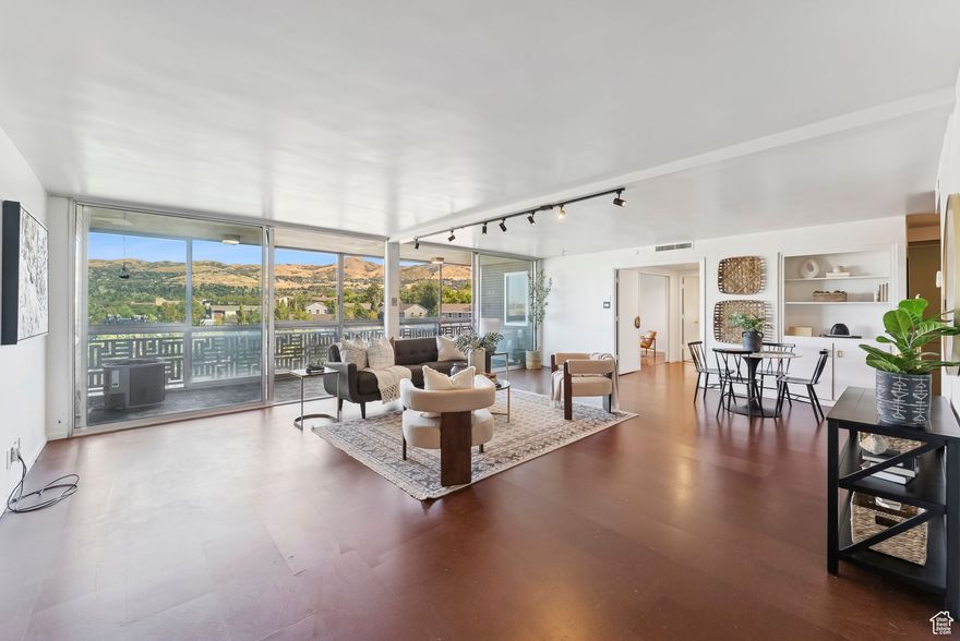 Exceptional opportunity to own one of the most stunning large condos perfectly located between downtown and the U of U. This spacious 3-bed, 3-bath luxury unit is a rare double-unit in the iconic mid-century Aztec Condos. Fully renovated in 2021 with high-end finishes throughout: Sub-Zero, Miele, and Thermador appliances, custom walnut and lacquer cabinetry, Ann Sacks tile, cork flooring, and wool carpet. Large enclosed terrace, walk-in pantry, and dedicated laundry room. Enjoy panoramic views of the Avenues foothills and State Capitol. Includes 2 covered parking spaces and 4 private storage units. Prime location just one block from TRAX and within walking distance to the University of Utah. Amazing views! Motivated seller! Square footage figures are provided as a courtesy estimate only and were obtained from county records.  Buyer is advised to obtain an independent measurement.