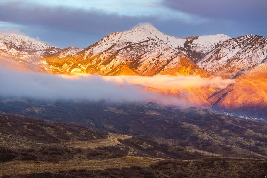 Build something exceptional on this .32-acre homesite in Draper's highly sought-after Suncrest community. Set on a private road with sweeping 270-degree views of the Wasatch Mountains and Utah Valley, this lot offers a rare chance to create a custom estate in one of the area's premier neighborhoods.  The gently sloped terrain is ideal for a walkout or multi-level design that maximizes the views. Utilities are available, and previously approved architectural plans are included to help fast-track your build.  Suncrest offers a peaceful setting with access to a clubhouse, pool, fitness center, and miles of private trails. You're minutes from Draper's dining, shopping, and business districts, with quick access to Salt Lake City, Provo, and world-class skiing at Snowbird, Alta, and Sundance.  This is more than land-it's the foundation for your next chapter. Reach out today to walk the lot and start planning your dream home.